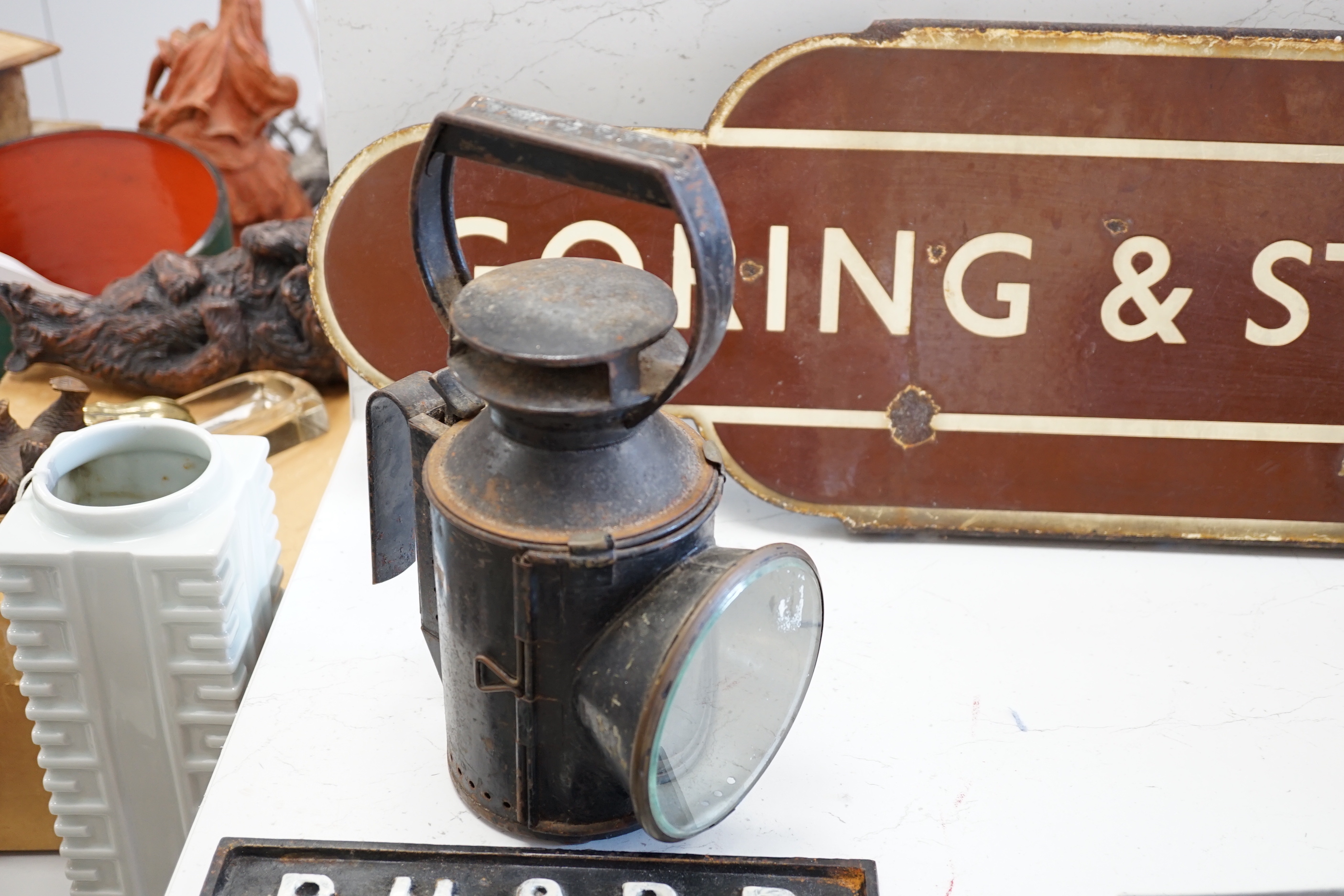 A railway-style clock and a BR hand lamp with burner and 2 signs: BR(W) Goring and Streatley enamel station totem, 91cm long, and an iron warning notice